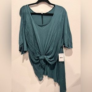 Free People Movement Tunic. NWT. Never worn, size x-s-Small. Runs big, loose fit